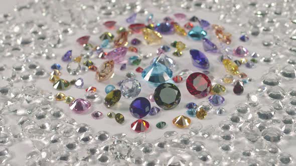 Multi Colored Diamonds Are Surrounded By White Diamonds.