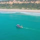 Fishing Boat Floating on Ocean Waves Near Shore - VideoHive Item for Sale