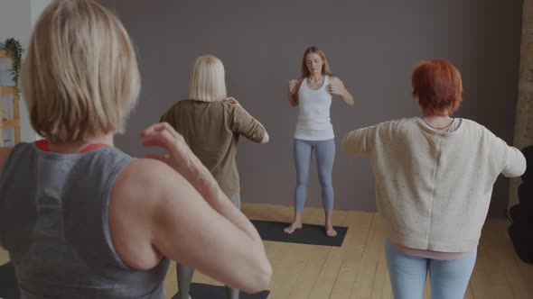Yoga Body Tapping with Instructor in Class