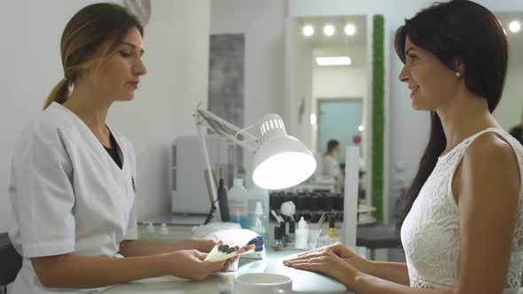 Charming Girl in a Manicure Salon