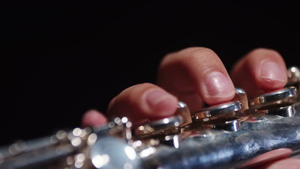 Female Musician Student of University of Arts Plays Flute in Studio Closeup Fingers