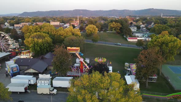 view of La Crosse, Wisconsin, in autumn during annual festival. Mountains and buildings in distance.