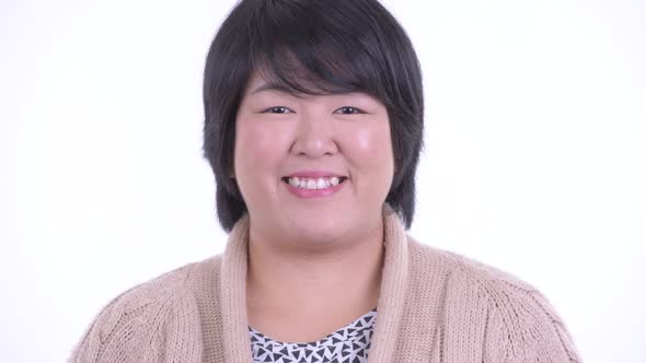 Face of Happy Overweight Asian Woman Smiling Ready for Winter