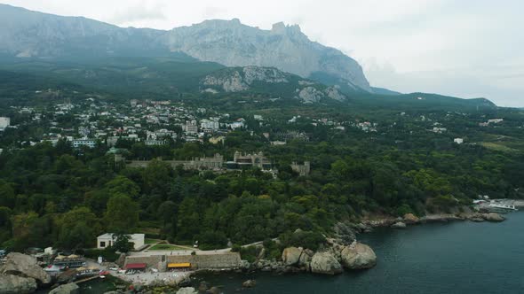 Vorontsov Palace in Alupka Aerial View From Sea with Ai Petri Mountain Peak in Background