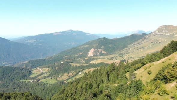 Aerial shot of mountain pasture. Hills in slovenia used for grazing livestock.