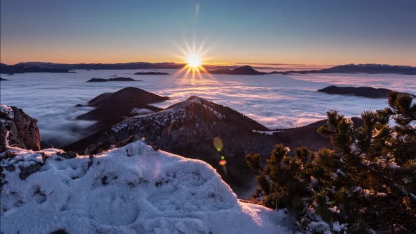 Sunset in Frozen Winter Mountains in Snowy Alps Nature with Foggy Clouds Motion Fast