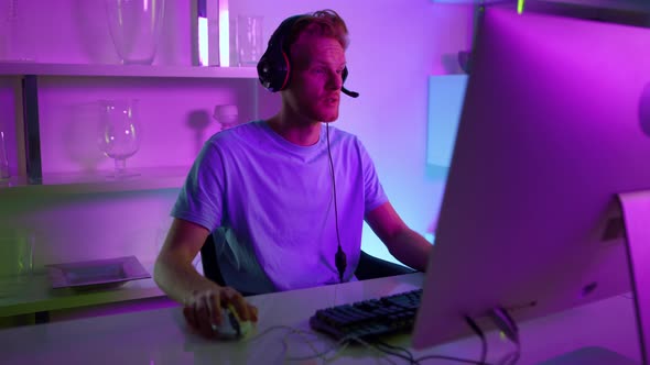 Man Having Live Stream in Neon Room