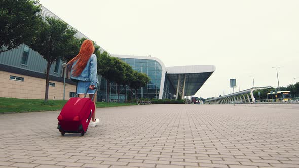 Woman Walking with Luggage. The Girl Goes on a Journey and Walks To the Airport. A Businesswoman