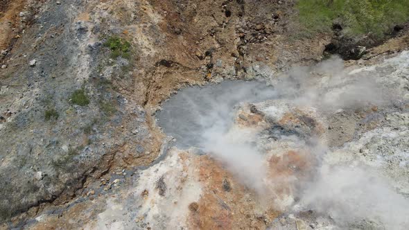 Aerial view of vulcano crater with sulfur vapor coming out of the sulfur marsh.