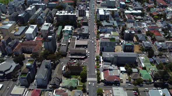 Drone shot of Sea Point, Cape Town - drone is revealing the ocean and some paragliders. Snippet coul