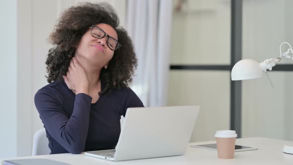 African Woman Having Neck Pain While Using Laptop