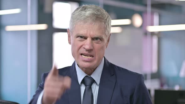 Portrait of Upset Middle Aged Businessman Getting Angry