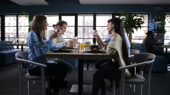 Joyful Friends Spending Time in Cozy Restaurant