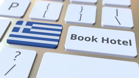 BOOK HOTEL Text and Flag of Greece on Keyboard