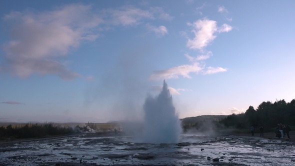 Environment. Iceland. Geyser in famous tourist attraction. Steam from fumarole in geothermal area.