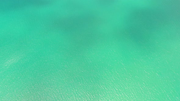 Sea Surface in a Turquoise Lagoon Top View