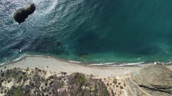 Aerial View on Calm Azure Sea and Volcanic Rocky Shores