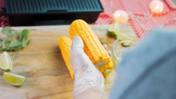 Grease with Oil and Put on the Grill Three Corn Plants