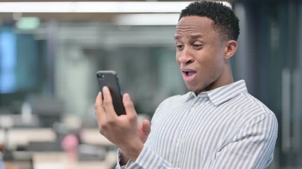 African Businessman Loss on Smartphone