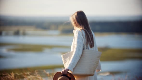 Young Woman Walking To Her Family on the Wheat Field