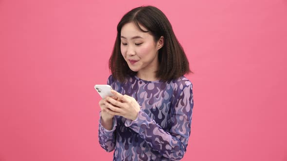 Handsome Asian woman making selfie on phone