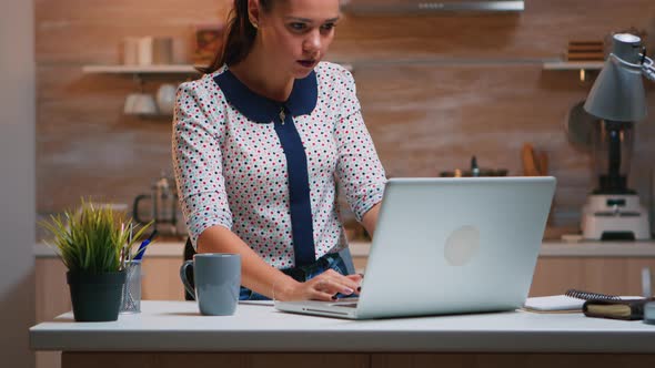 Freelancer Receving Good News on Laptop