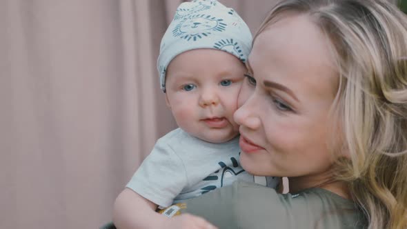 Loving Happy Tender Mom Holding Adorable Cute Baby Boy Hugging Little Baby