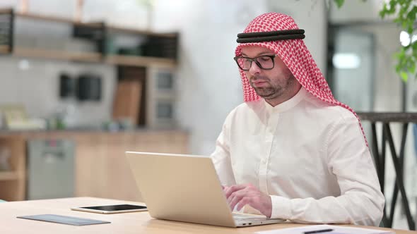 Young Arab Businessman Working on Laptop in Office 