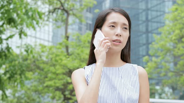 Woman use of mobile phone in Central of Hong Kong 