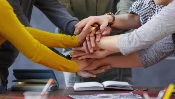 Casually Dressed Startup Team Joining Hands