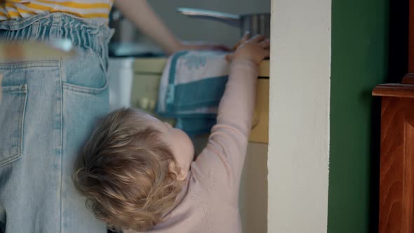 Cinematic Authentic Shot of Happy Mother and Her Little Toddler Baby Boy Son are Having Fun to Make