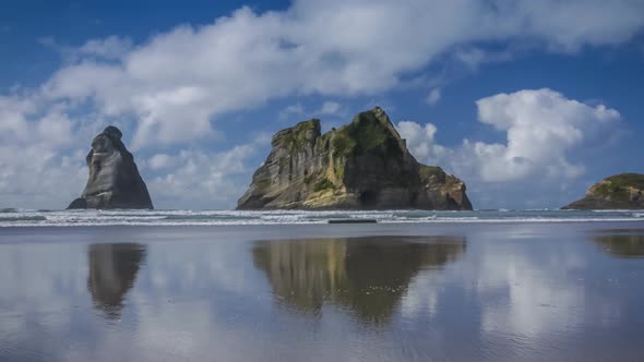 Wharariki Beach with coastal rocks