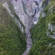 Aerial shot of a canyon with a huge waterfall in Slovenia. - VideoHive Item for Sale