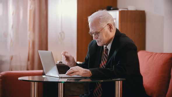 Elderly Grandfather - Old Grandfather Is Wearily Putting Glasses on the Table