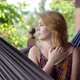 Attractive Young Woman Rrelaxing in a Hammock - VideoHive Item for Sale