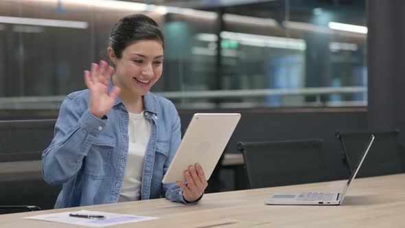 Video Chat on Tablet By Indian Woman at Work