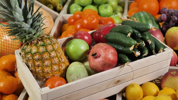 Wooden Box with Vegetables and Fruits on the Counter of the Store