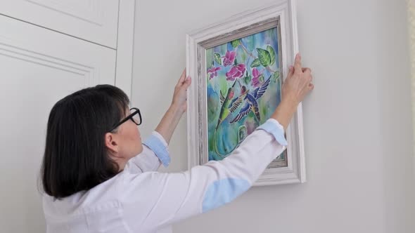 Woman Hanging Floral Birds Art Framed at Home on the Wall