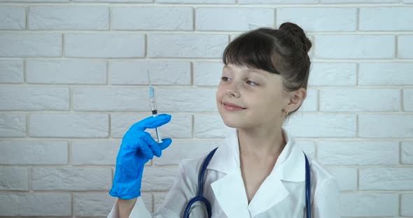 Child Nurse with a Syringe