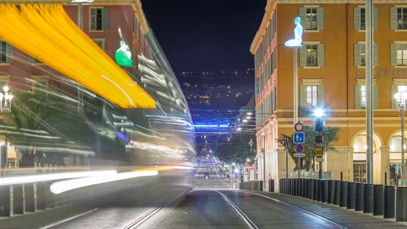 Night Cityscape with Moving Tram on Massena Square in Downtown Timelapse