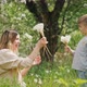 Happy Mom with Little Son Play with Dandelions in a Blooming Garden - VideoHive Item for Sale