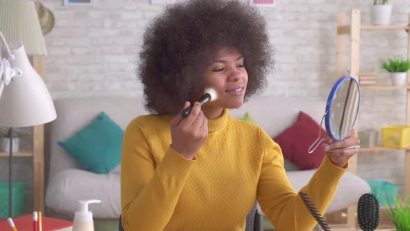 African American Woman Positive Makeup Looking in the Mirror in Modern Apartment Slow Mo