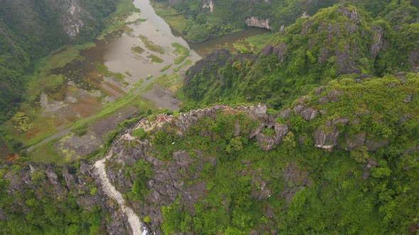 Aerial Shot of the Small Temple and a Dragon on the Top of Marble Mountain Mua Cave Mountain in Ninh