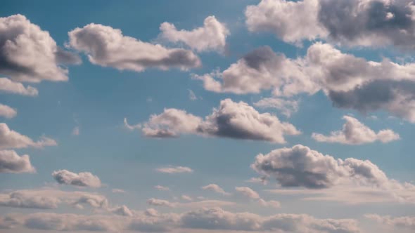 Timelapse of Light White Puffy Clouds Moving in the Blue Sky Cloud Space