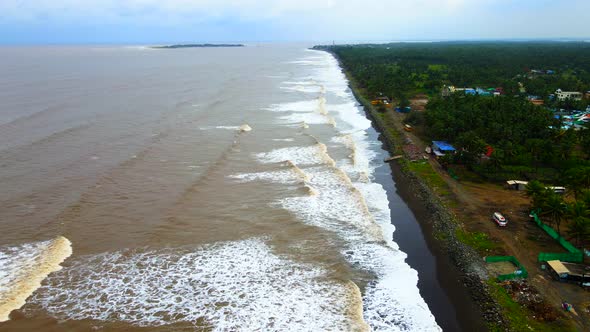 beach at vasi rajodi beach  waves india mumbai maharashtra drone shot india birds eye view .