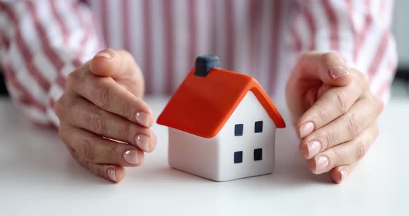 Insurance Agent Protects House with Hands Slow Motion  Movie