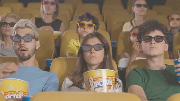 Absorbed People Watching Film in Cinema. Portrait of Men and Women of Different Ethnicities Enjoying