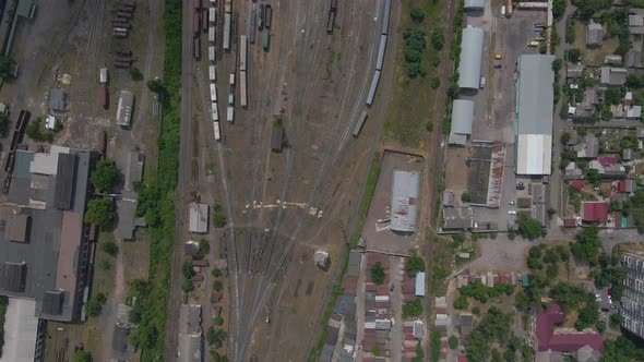 Top View of Many Tracks at the Railway Station with Lots of Trains Parked