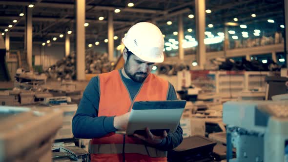 Industrial Worker in a Unit with Defective Office Machines