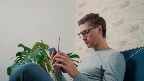 Lifestyle Concept  Young Man Working with Tablet Pc Computer